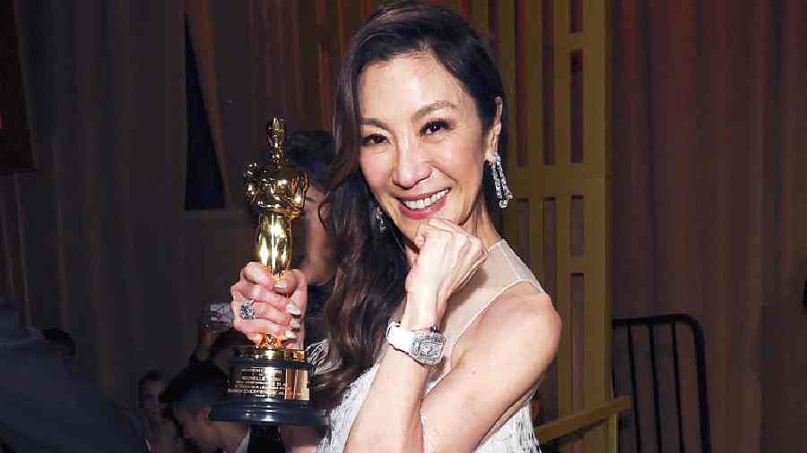 Michelle Yeoh with her Best Actress in a Leading Role statuette