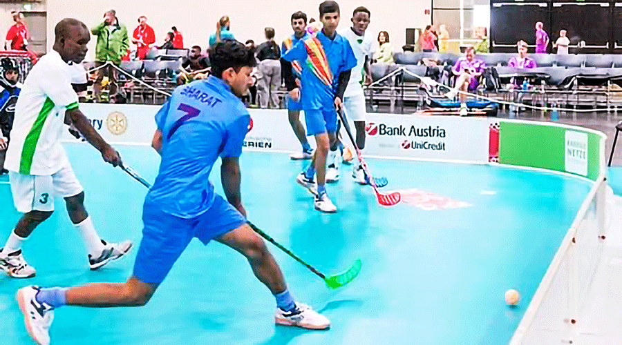 Rabiul (with red hockey stick) plays a match in the Special Olympics World Winter Games in Austria in 2017.