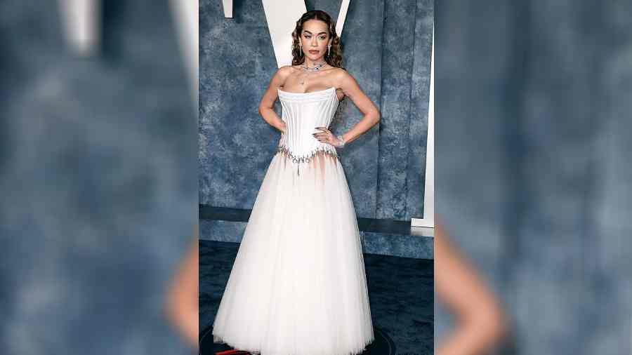 Rita Ora opted for a corseted gown in white from Wiederhoeft. While the outfit had a Disney princess charm, the bodice was attached to the skirt with chain link, making it super edgy