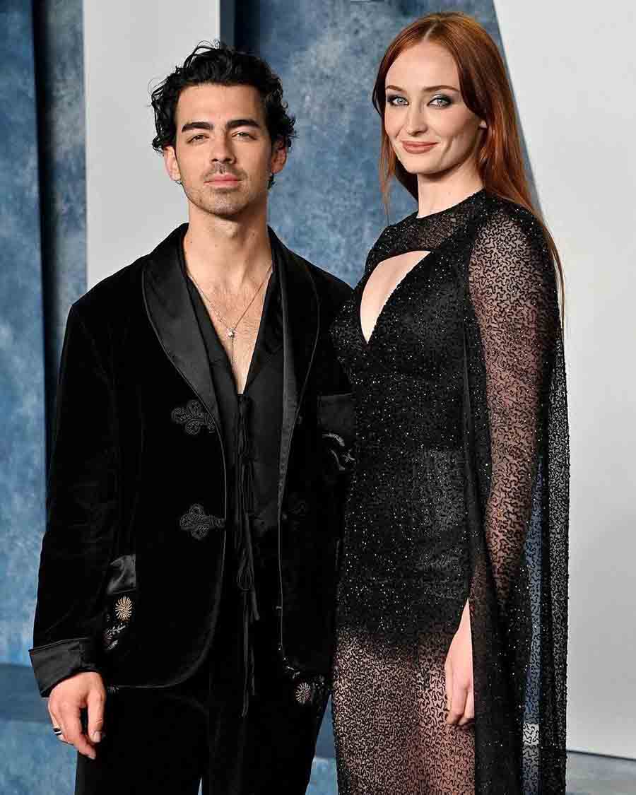 Joe Jonas and Sophie Turner enjoyed a date night at the party. Sophie went for a glam Louis Vuitton gown with a sheer skirt, while Joe opted for a black velvet Bode suit with minimal flower embroidery. 