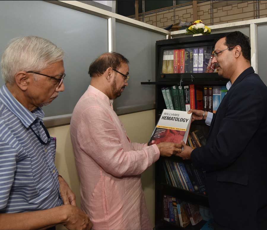Kolkata Municipal Corporation’s (KMC) health department opened a library-cum-reading room at the adjoining chamber of the chief medical health officer's chamber at the KMC Headquarters on Tuesday. In pic, deputy mayor Atin Ghosh takes a look at a book      