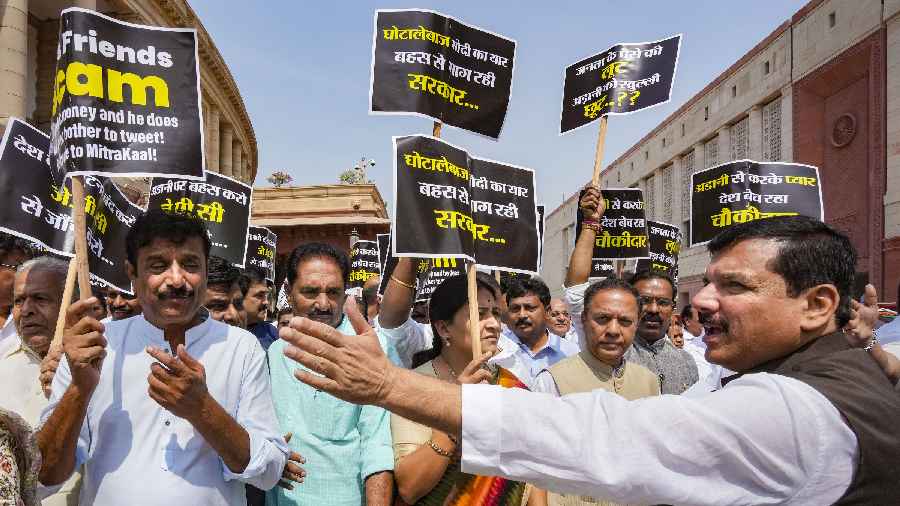 Opposition MPs during a march from Parliament House to Enforcement Directorate (ED) office to submit a complaint over the Adani issue, in New Delhi