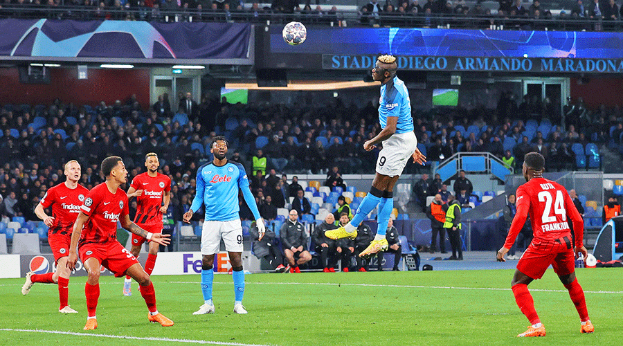 Victor Osimhen leaps high to head home Napoli’s first goal against Eintracht Frankfurt at Stadio Diego Armando Maradona in Naples on Wednesday.