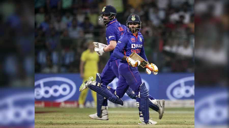 India's KL Rahul and Ravindra Jadeja run between the wickets during the first one-day international (ODI) cricket match between India and Australia at the Wankhede Stadium, in Mumbai
