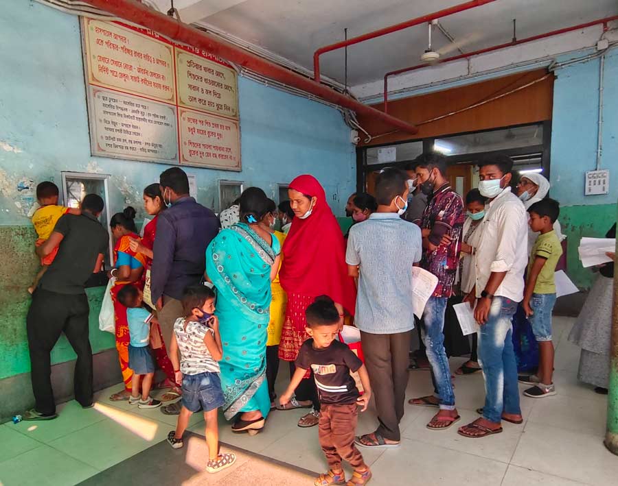 Parents with their kids at the enquiry section of BC Roy hospital as more cases of fever and respiratory diseases were reported in West Bengal  