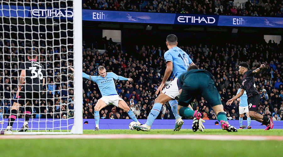 Erling Haaland (second from left) scores Manchester City’s third goal, and his hattrick, during the FA Cup quarter-final match against Burnley on Saturday.