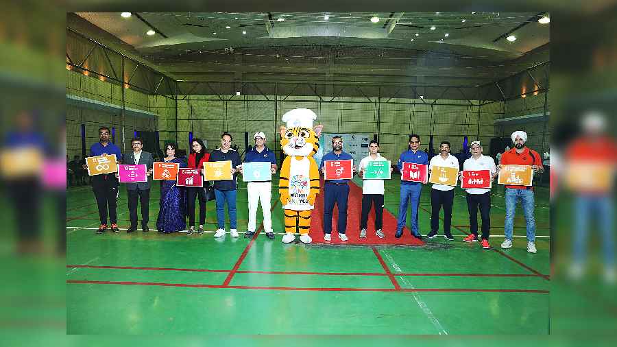 The general managers of participating hotels who played the GM’s match posed with the placards of 12 sustainable development goals of the United Nations
