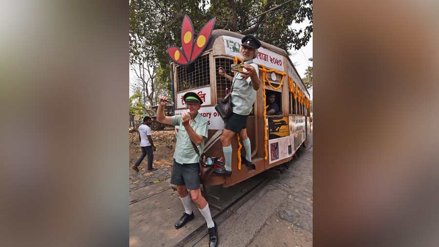 Tony Graham and Roberto D'Andrea pose with tram cards to promote Tramjatra 2023 at Esplanade tram terminus  