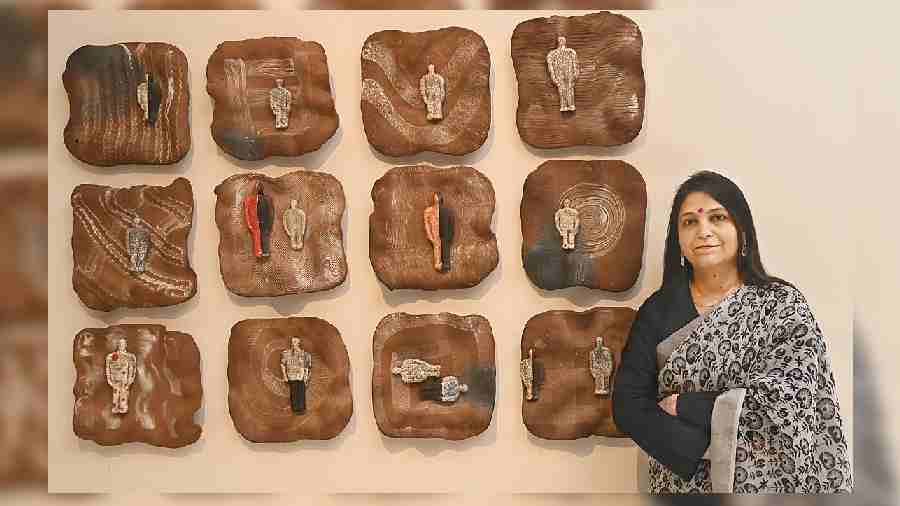 Artist Falguni Bhatt poses with her Lost Landscapes at Emami Art. Bhatt, who also curated the exhibition, said, “The first edition was called Bhu and this is the continuation of it and is called Bhu-Tatva. Bhu means earth and tatva means elements. In this show, we have P.R. Daroz, who is almost 80 and the youngest is Shilpi Sharma, who is 25. There are a few from Calcutta as well. All the sculptures are based on the theme of elements of earth and are very earthy. I use twothree kinds of techniques for my art like terracotta and stoneware and the figures are in raku fire, which is a little different than the usual technique.”
