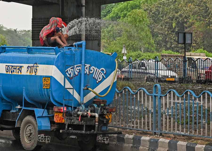 A Kolkata Municipal Corporation (KMC) tanker waters plants in gardens maintained by the corporation on VIP Road  