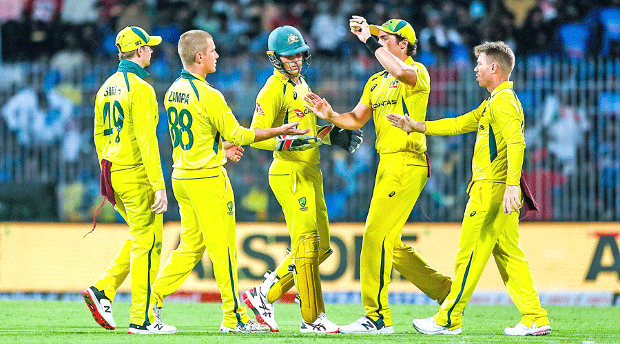 Man of the Match Adam Zampa (second from left) celebrates with teammates after dismissing KL Rahul in the final ODI of the series at the MA Chidambaram Stadium in Chennai on Wednesday.