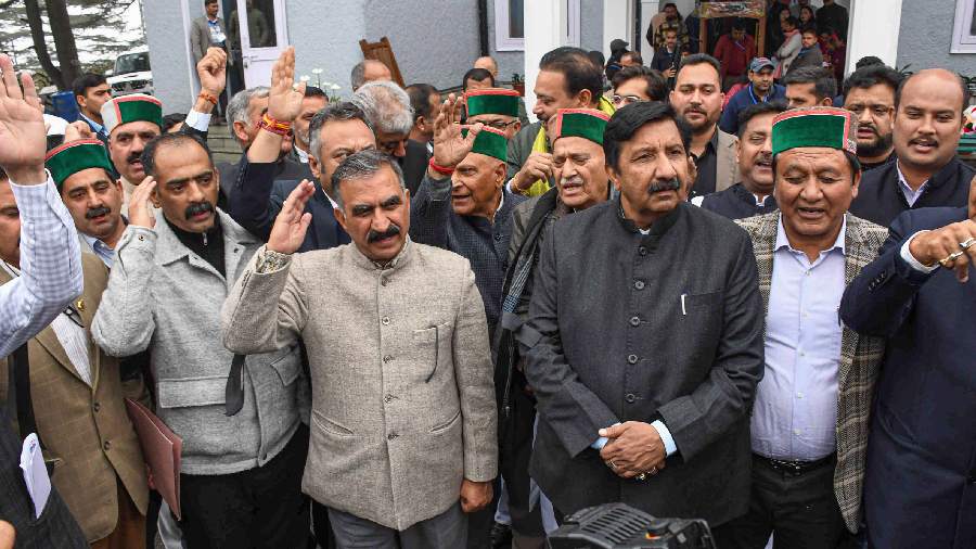 Himachal Pradesh Chief Minister Sukhvinder Singh Sukhu with supporting MLAs raises slogans during a protest against the conviction of Congress leader Rahul Gandhi in a 2019 criminal defamation case, in Shimla. 