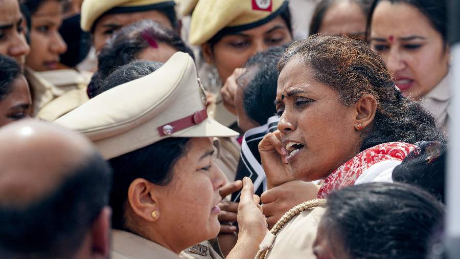 Congress MP Jothimani Sennimalai in a scuffle with police personnel during a protest march towards Rashtrapati Bhawan, at Vijay chowk in New Delhi. 