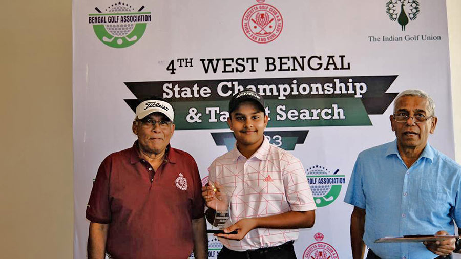 Mishra collecting his trophy