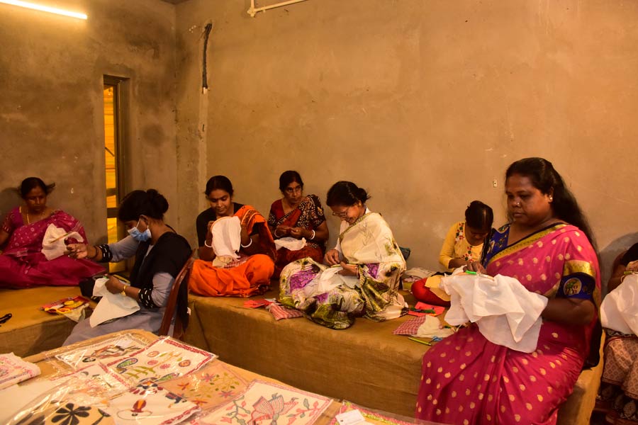 Women participate in the national-award-winning kantha artist Bina Dey’s kantha workshop