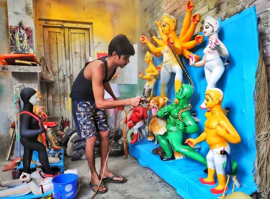 An artist at Kumartuli is busy giving final touches to the idol ahead of Basanti Puja on Tuesday, March 28. Basanti Durga Puja is held in the month of Chaitra in the Bengali calendar. This is the original celebration of Durga Puja  