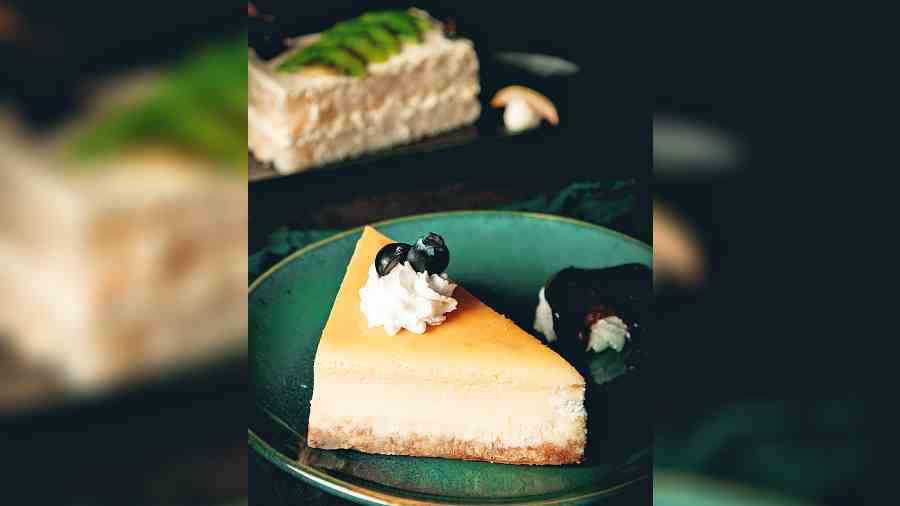A classic New York Cheesecake topped with cream cheese and a blueberry compote is sinful.