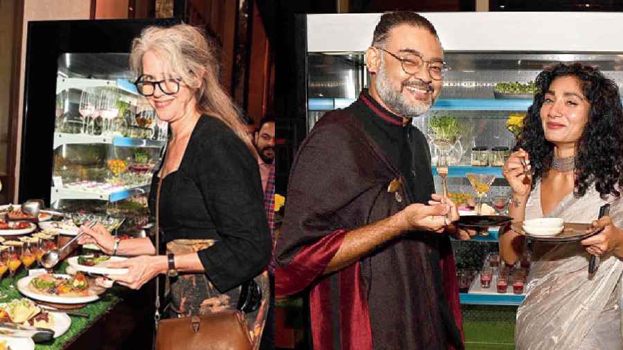 (l-r) Australian consul general Rowan Ainsworth gives the salad bar a go, Swarup Dutta and Sneha Ghosh are all smiles