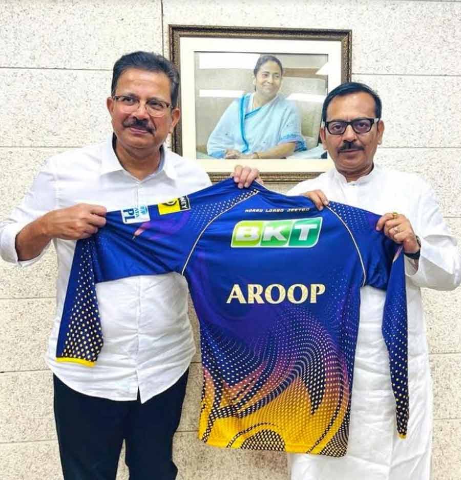 Venky Mysore, CEO of Red Chillies Entertainment and CEO and managing director of the Indian Premier League team Kolkata Knight Riders handed over a new jersey to West Bengal sports and youth affairs minister, Aroop Biswas, on Tuesday     