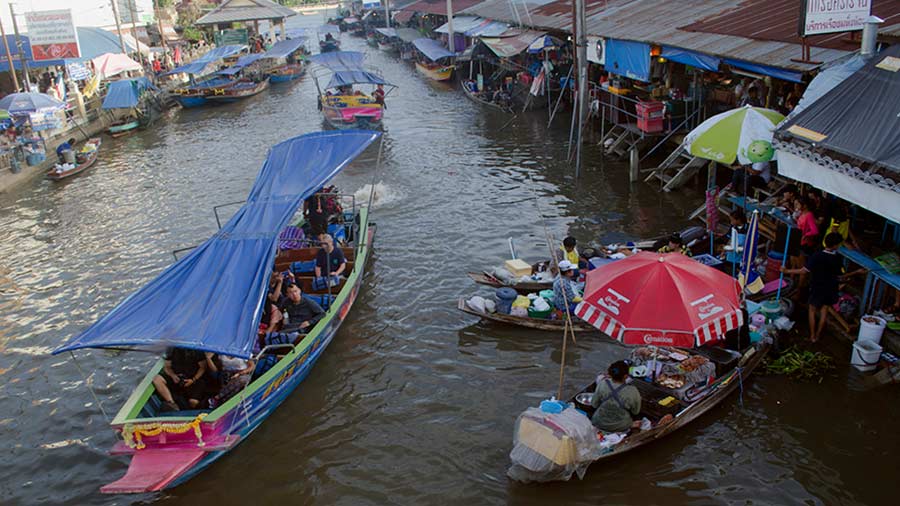 Cruising past the food boats at Amphawa Floating Market near Bangkok