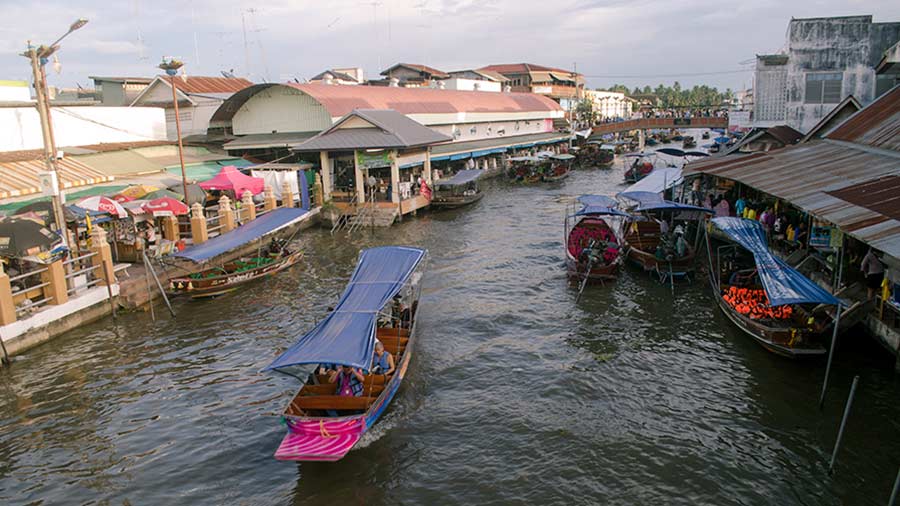 Amphawa Canal lined with walkways and shops on both sides 