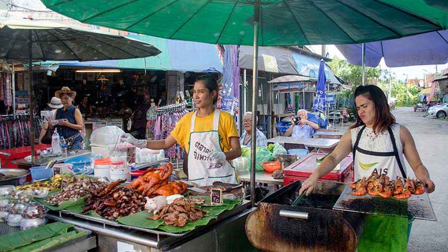 Food vendors do a brisk business at Amphawa Floating Market