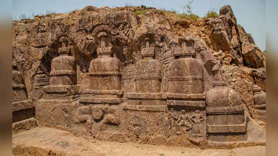 Rock-cut stupas and votive stupas on Langudi Hill