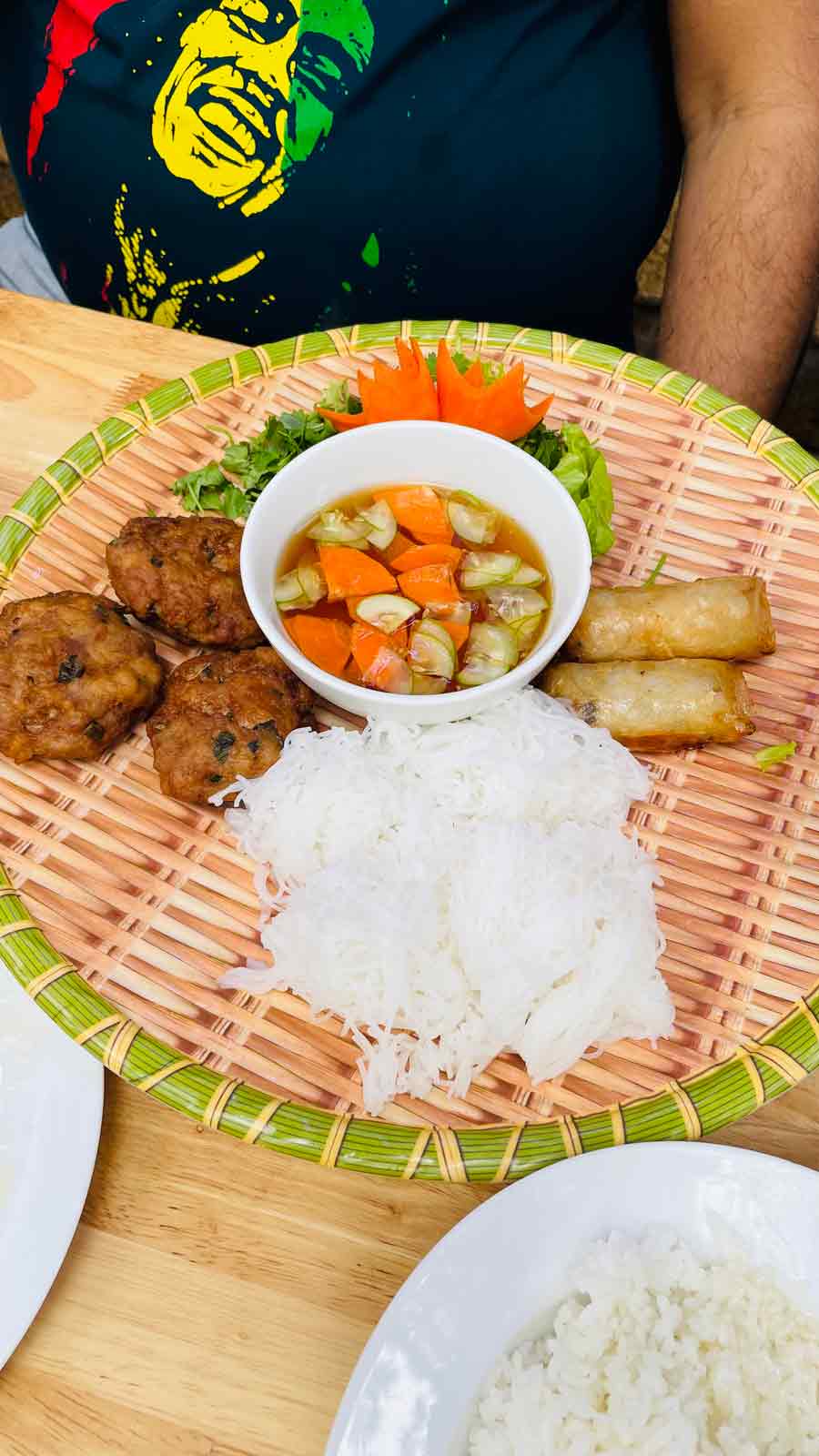 Bun Cha: This gorgeous platter, believed to have originated in Hanoi, is one of the most popular dishes to try in Vietnam. Traditionally, Bun Cha features grilled pork meatballs along with rice noodles, topped with lots of fresh herbs and a dipping sauce on the side. Sometimes, it also has deep-fried spring rolls (in image). The cold or lukewarm noodles it is served with makes this more of a salad than a dish. The combination of the cold noodles, hot meatballs and sweet-salty-tangy dipping sauce is one of a kind. The sauce is made with a base of fish sauce with chillies and you drizzle some soya sauce for an umami-infused kick! 