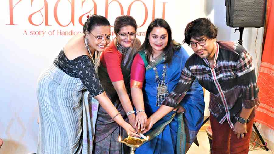 (L-R) Singer Lopamudra Mitra and Jayati Mukherjee, National Institute of Fashion Technology jewellery designing faculty, who were guests at the inauguration, joined Joita Sen and designer Manas Ghorai in lighting the inaugural lamp.