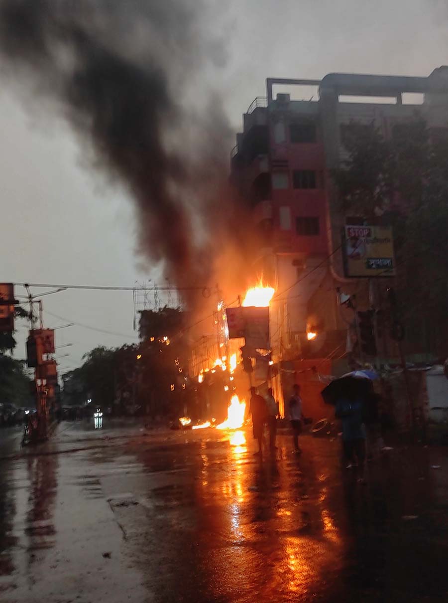 The fire at a dry fruits shop next to a petrol pump on Jessore Road on Sunday