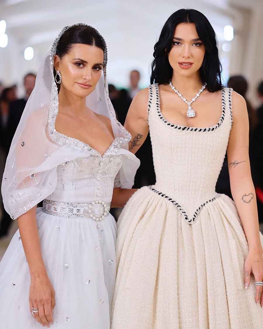 (L-R) MET Gala co-chairs Penelope Cruz and Dua Lipa showed up in vintage Chanel outfits. Penelope stunned in a 1988 gown with a shawl collar, while Dua wore a corseted dress from the house’s 1992 haute couture fall-winter collection.