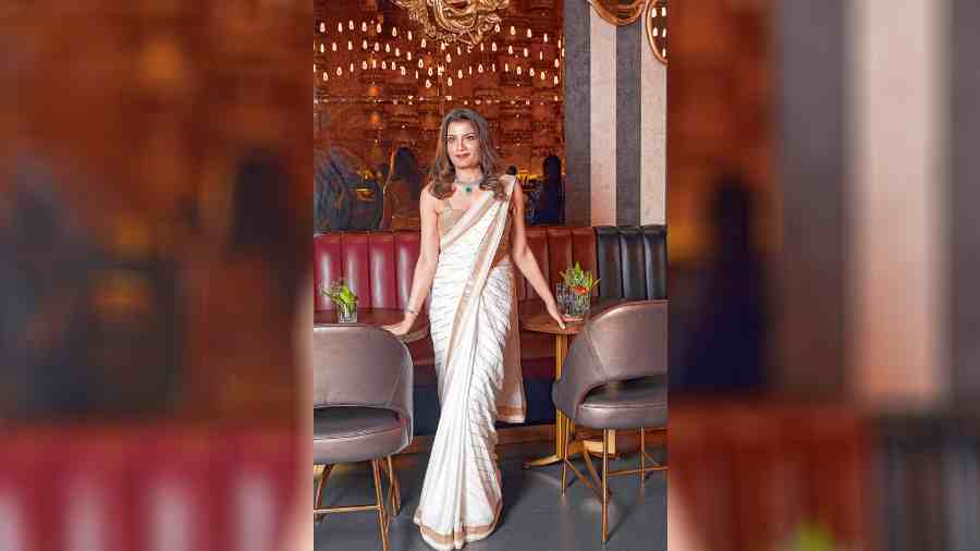 Jyotee Khaitan, who co-hosted the party, wore a white and gold sari from her collection for the Poila Baisakh celebration. “It was a lovely get-together of friends to celebrate the year which is fresh and new. The evening was full of laughter, joy and happiness; everyone tried to dress up and turned up in their stylish best looks. Cocktails and sumptuous food with great music made it an evening to remember. The decor complemented the theme of celebrating the Bengali New Year and it was one big family of friends partying and wishing well for each other,” said Jyotee.