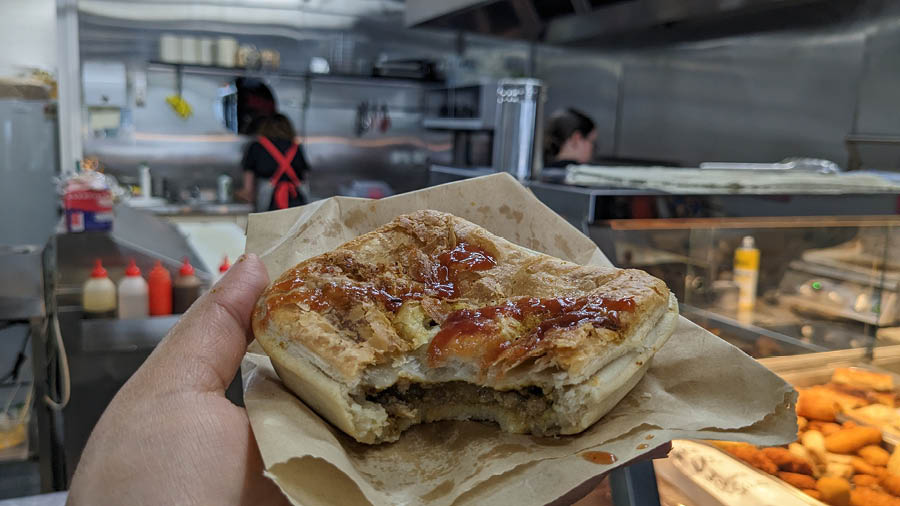 A bite of the classic Aussie meat pie available in canteen and gourmet versions across the country