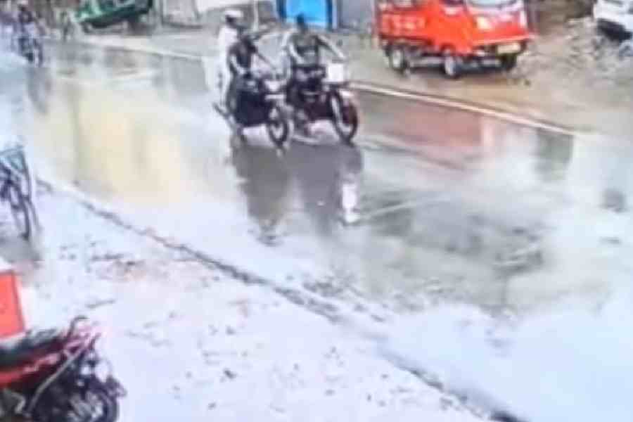 CCTV footage shows a bike with its pillion rider (in white) holding an object that looks like a gun and pointingat the bike to his left
