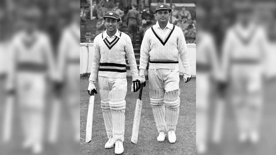 Batting tailenders Chandu Sarwate (1920 - 2003) and (right) Shute Banerjee (1911 - 1980) of India walk to the wicket to continue their first innings for the touring Indian Cricket Team against Surrey County Cricket Club on May 13, 1946, at the Kennington Oval cricket ground in London, England. Sarwate went on to score 124 not out and Banerjee 121 with India winning the match by 9 wickets