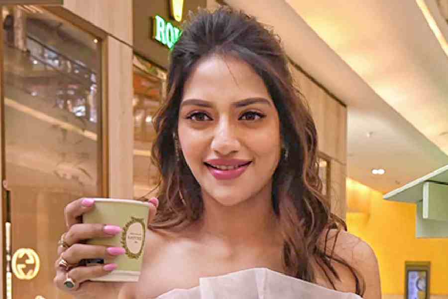 Actress Nusrat Jahan was spotted in a black-and-white ruffled dress as she sipped her coffee at the launch.