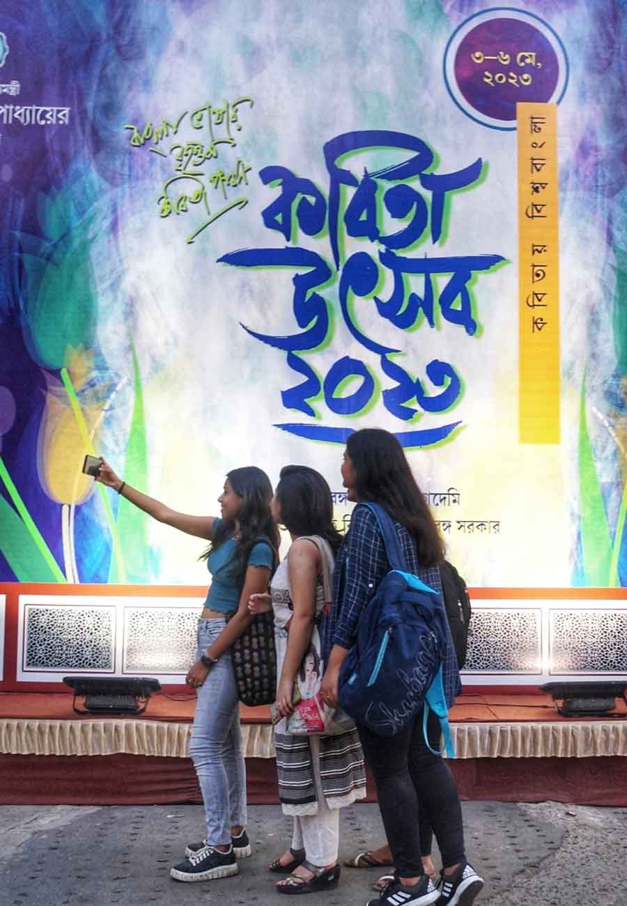 Visitors click selfies at Kabita Utsav on Friday at Nandan. The four-day festival which ends on Saturday has been organised by the Paschim Banga Kabita Academy  