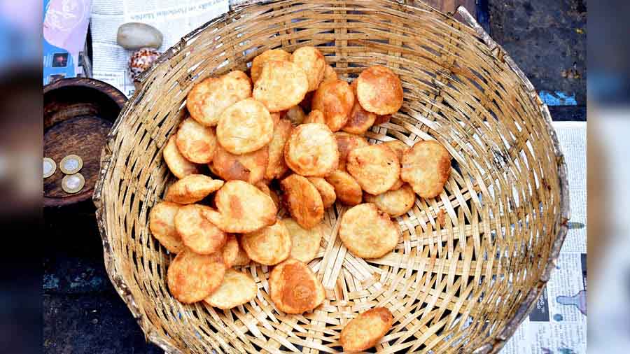 The tiny puris are stuffed with an alu filling, and served with a bhaji  