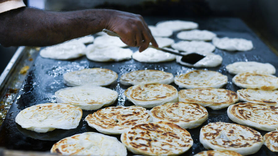 Kerala porottas being made at a street food stall at Kodaikanal 