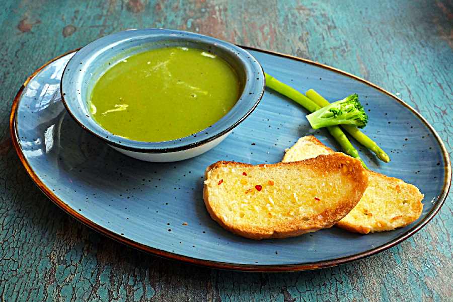 The Cream of Asparagus and Broccoli is a perfect blend of exotic veggies and cream, served with garlic bread.