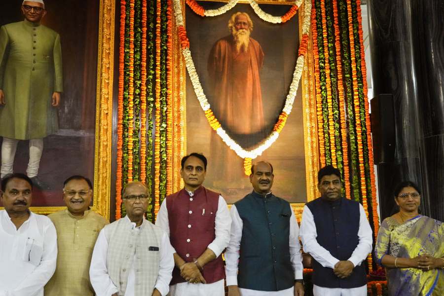 Lok Sabha Speaker Om Birla with other dignitaries poses for a photo after paying floral tribute to Nobel laureate poet Rabindranath Tagore on his birth anniversary, at Central Hall of Parliament House in New Delhi.  Lok Sabha Speaker Om Birla launches a digital coffee table book of Parliament Library on the occasion of his birth anniversary. 