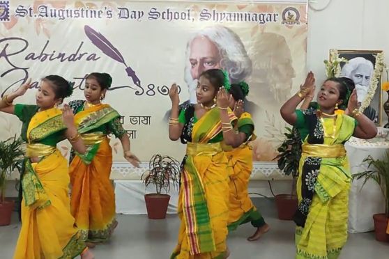 Primary school children puts up a dance performance on a song by Rabindranath Tagore to celebrate his 162nd birth anniversary