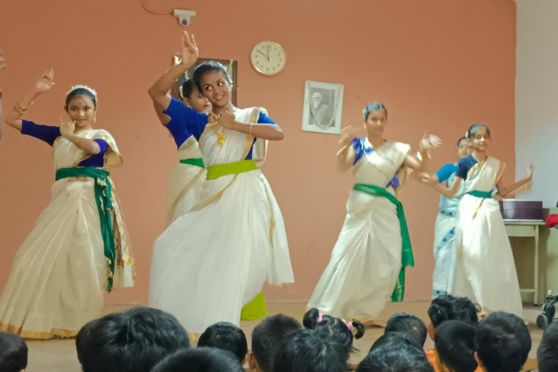 Junior & Middle school children performs a group dance to celebrate the birth anniversary of Rabindranath Tagore