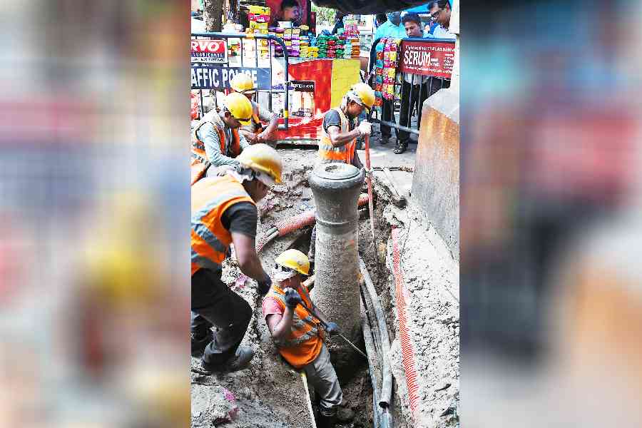 The iron object resembling the barrel of a cannon being excavated at the Fairlie Place-Strand Road crossing on Tuesday. 