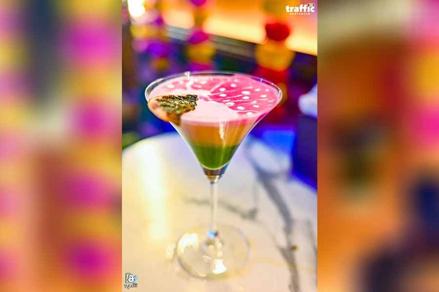 Mango Masala Fizz starts with a base of aam panna and mango juice mixed with orange juice and a splash of grenadine syrup for a pop of colour. The drink is then seasoned with a pinch of chaat masala and kafir lime leaves, which adds a subtle spiciness and citrusy aroma. To finish, a dollop of fresh cream is added on top, creating a creamy and indulgent texture.