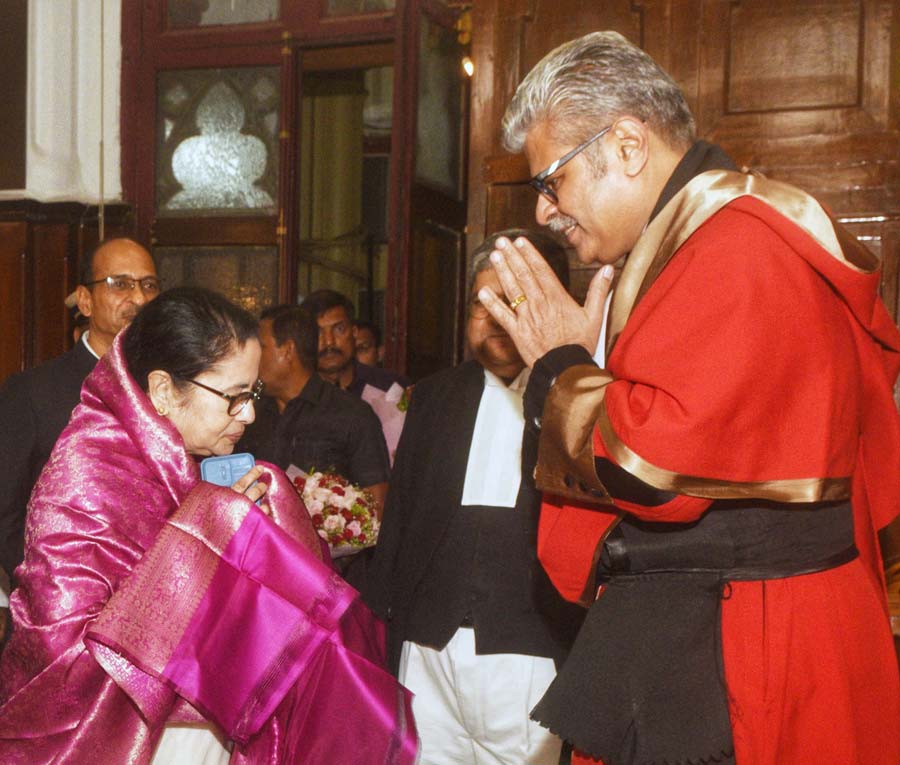 Acting Chief Justice TS Sivagnanam was sworn in as the chief justice of Calcutta High Court on Thursday. Chief minister Mamata Banerjee later greeted him at court number one 