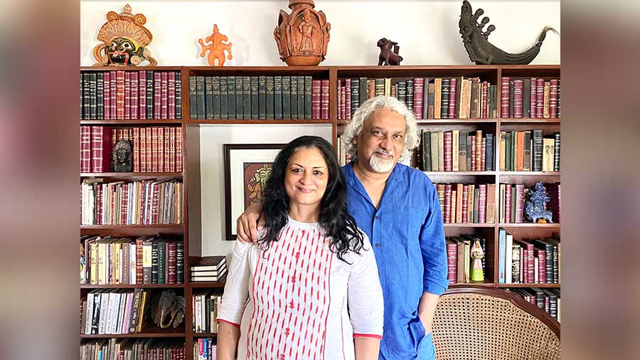 Kunal Basu with his wife, Susmita Basu, a ceramics artist, in their book-filled south Kolkata residence