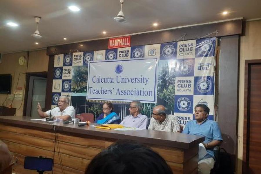 Members of the Calcutta University Teachers’ Association at the news conference on Monday