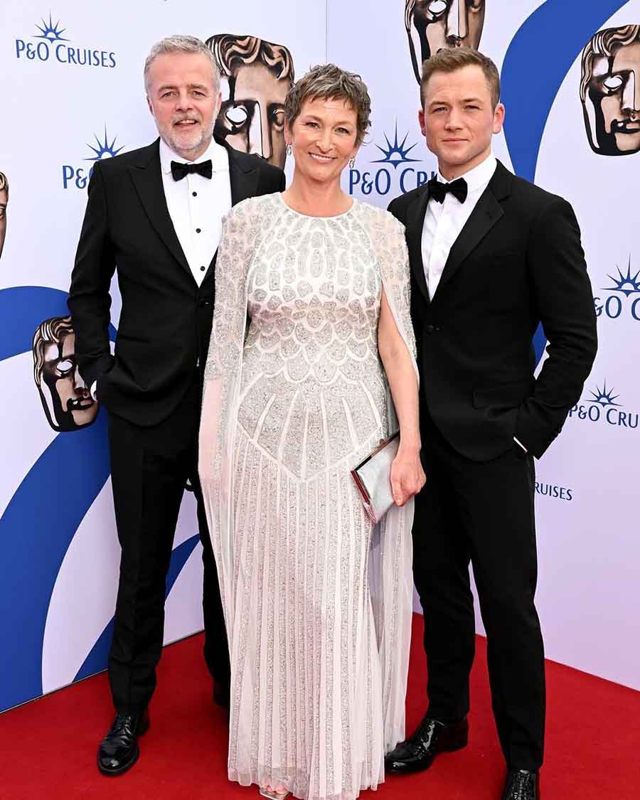 Taron Egerton, who got nominated for Best Leading Actor, attended the event in a black suit. His father twinned with the actor at BAFTA TV Awards, while his mother stunned in a cream gown.