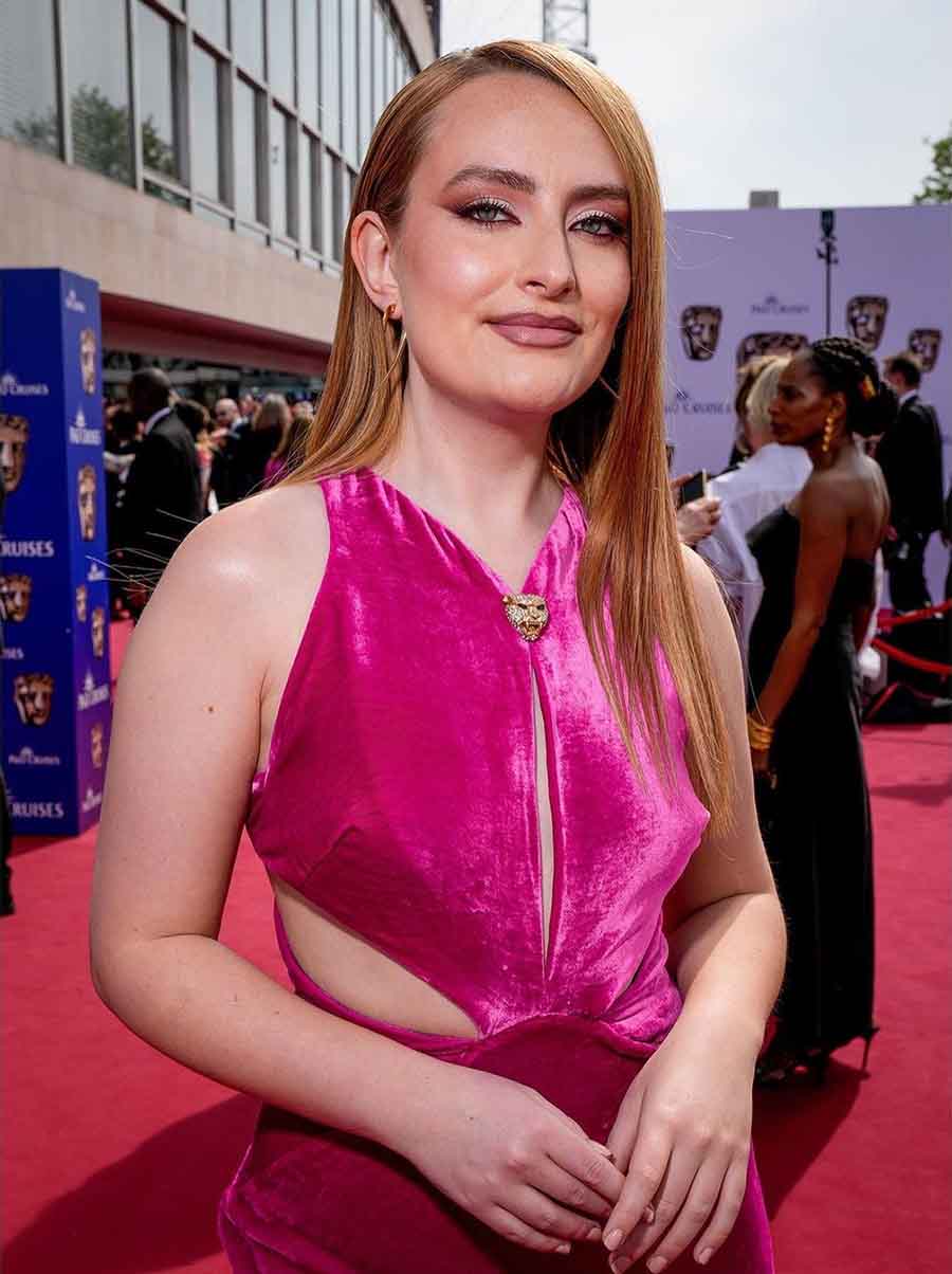 Amelia Dimoldenberg, the creator of Chicken Shop Date, attended the event in a hot pink velvet dress as a backstage host.